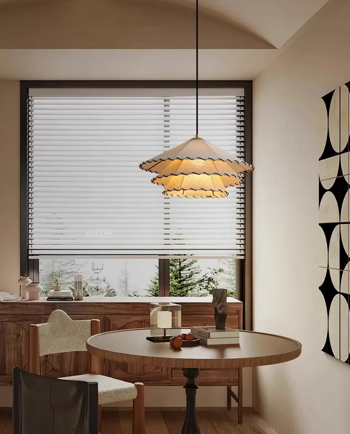 Warm ambient lighting from beige fabric pendant lamp in spacious dining area with potted plant decor