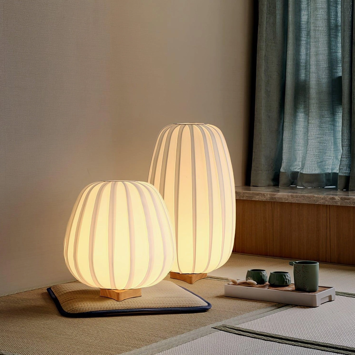 Fabric table lamp duo in Japanese tatami room with traditional tea service setup