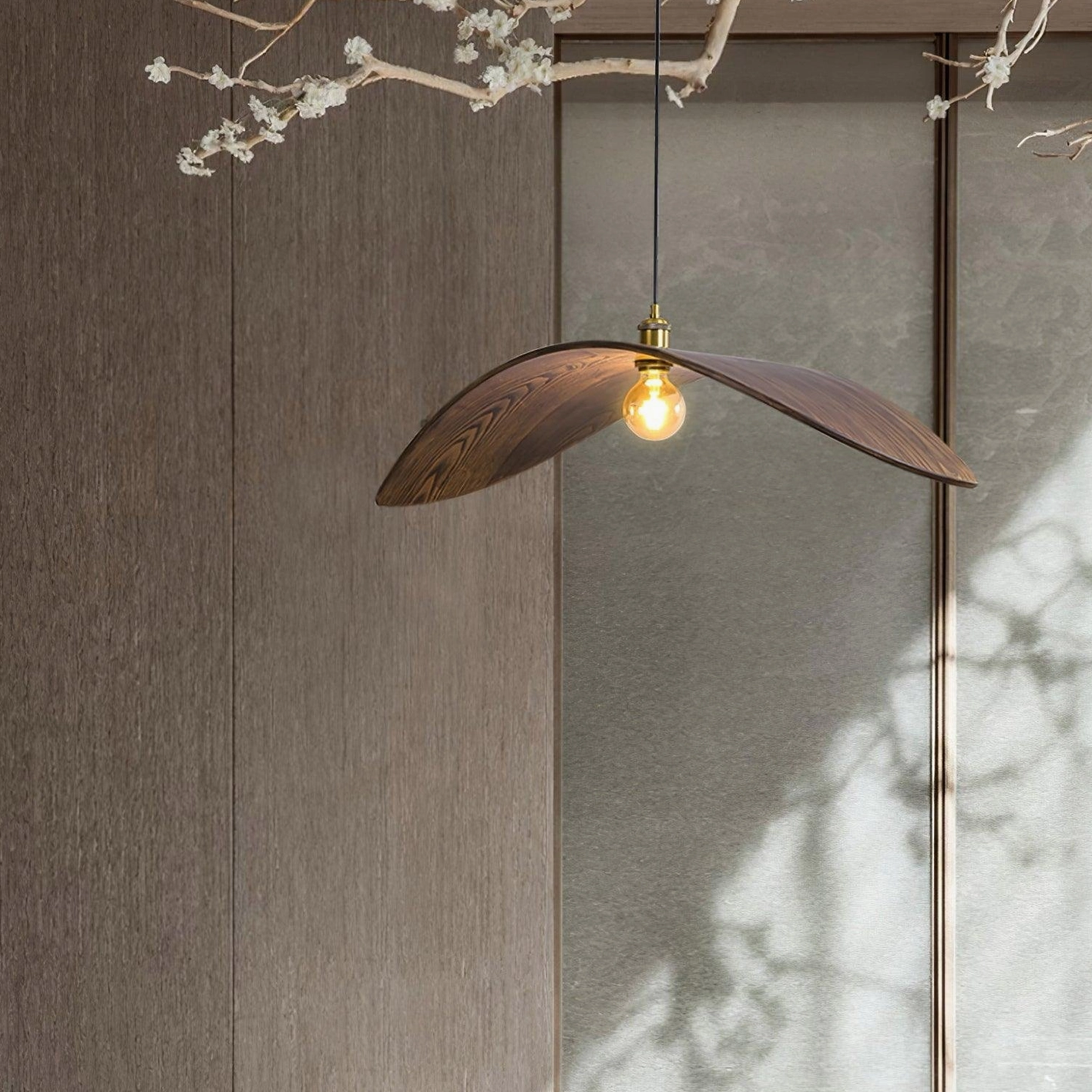 Walnut wood leaf pendant lamp installed in farmhouse rustic modern interior with organic design elements