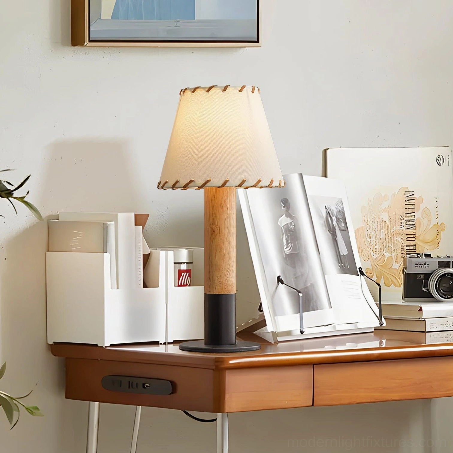 Rustic wood table lamp with hand-stitched fabric shade displayed on home office desk with warm ambient lighting
