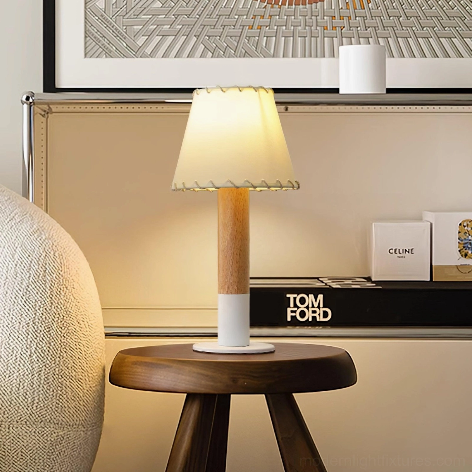 Rustic fabric shade table lamp displayed on round wood stool with luxury decor and home shelf backdrop