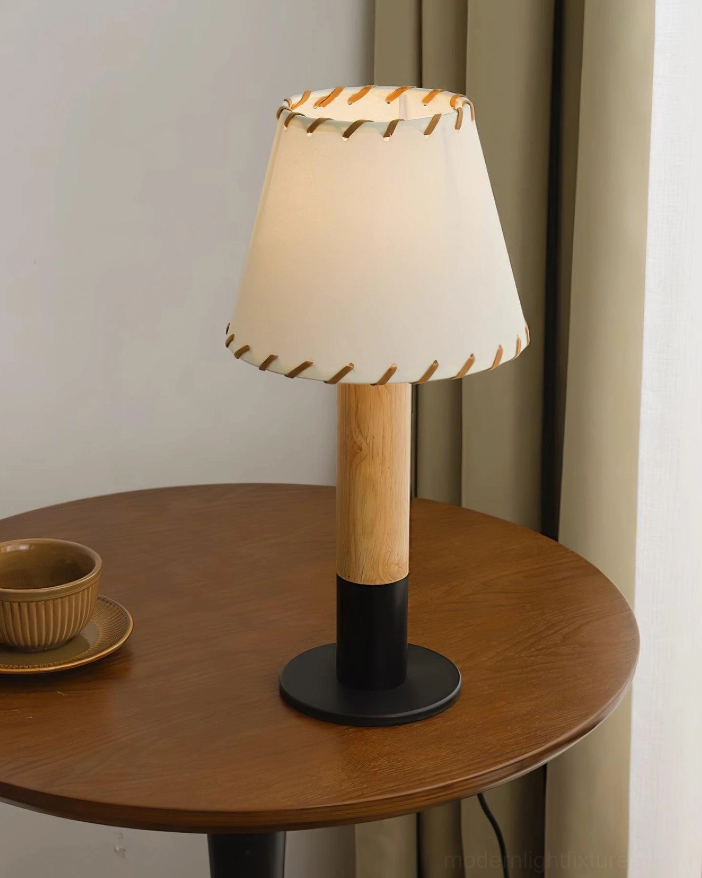 Farmhouse style rubber wood table lamp with natural wood finish and cream fabric shade accent