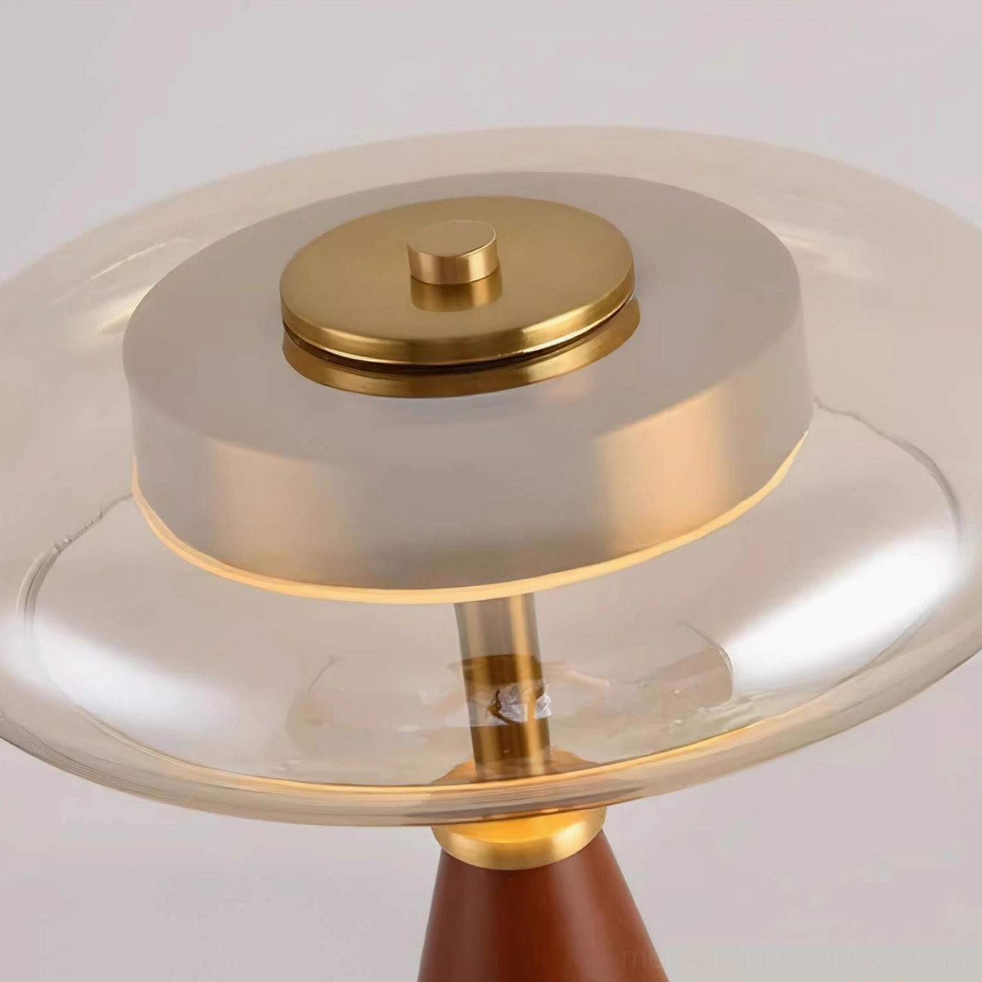 Fathom table lamp shade close-up showing double-layer cognac glass and brass fixture detail
