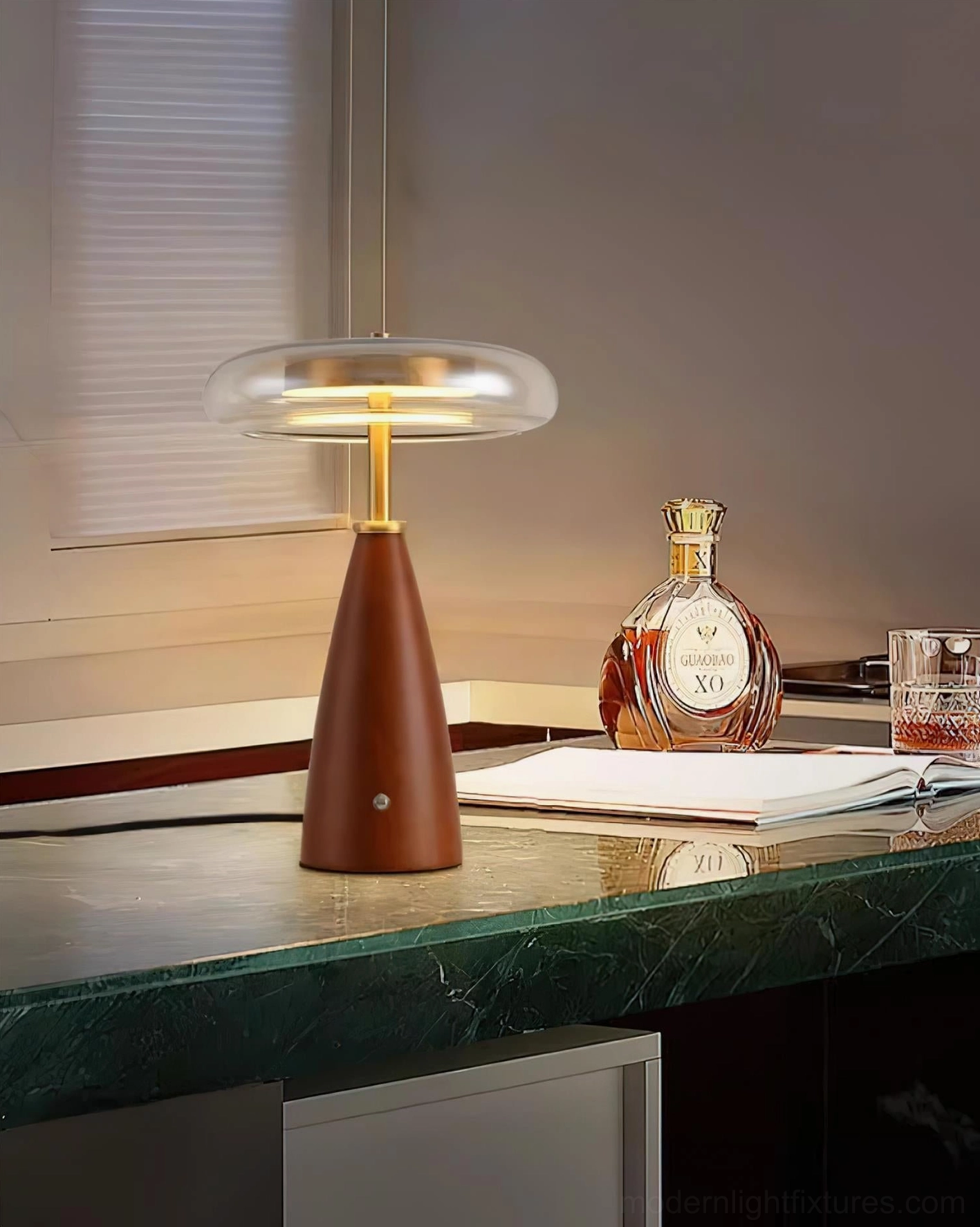 Fathom designer table lamp on green marble bar counter with minimalist retro aesthetic and warm glow