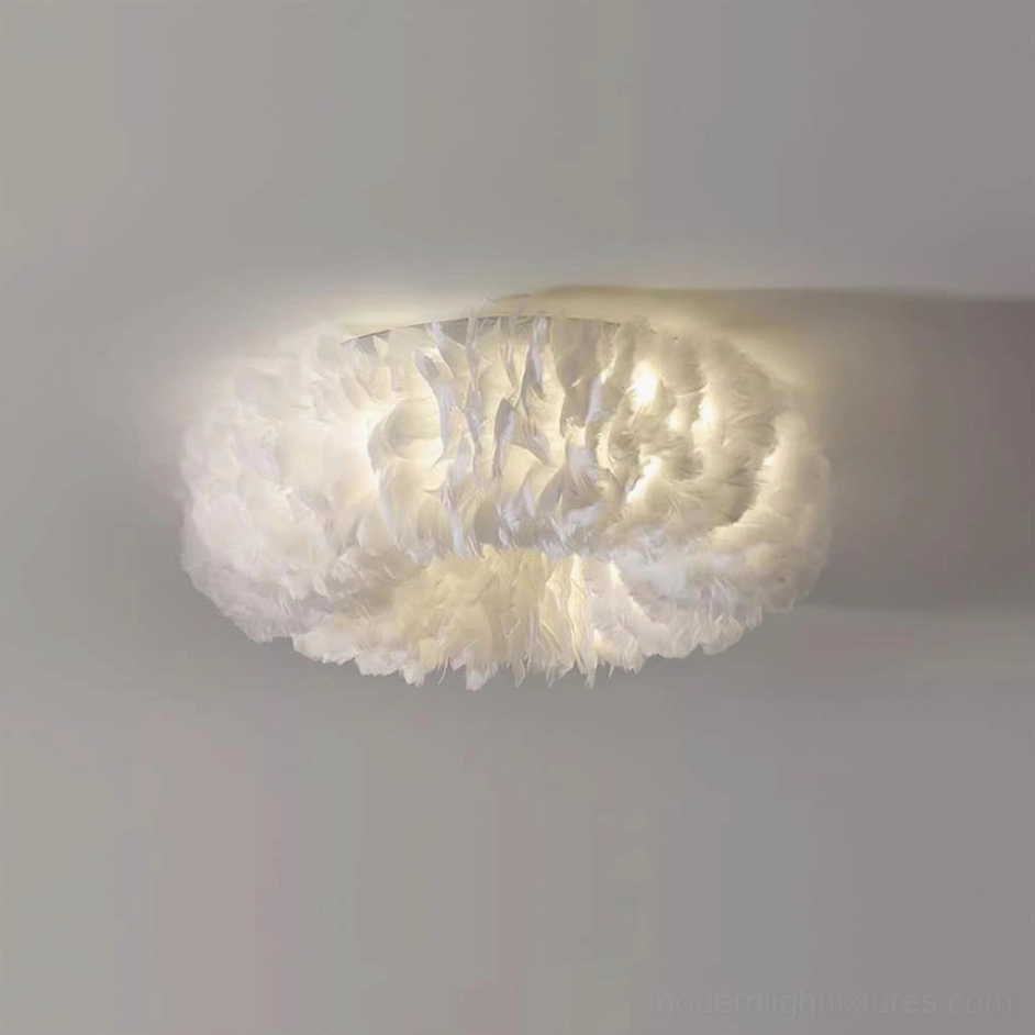 White feather ceiling light fixture creating cloud like soft presence in Scandinavian and minimalist interior design aesthetic