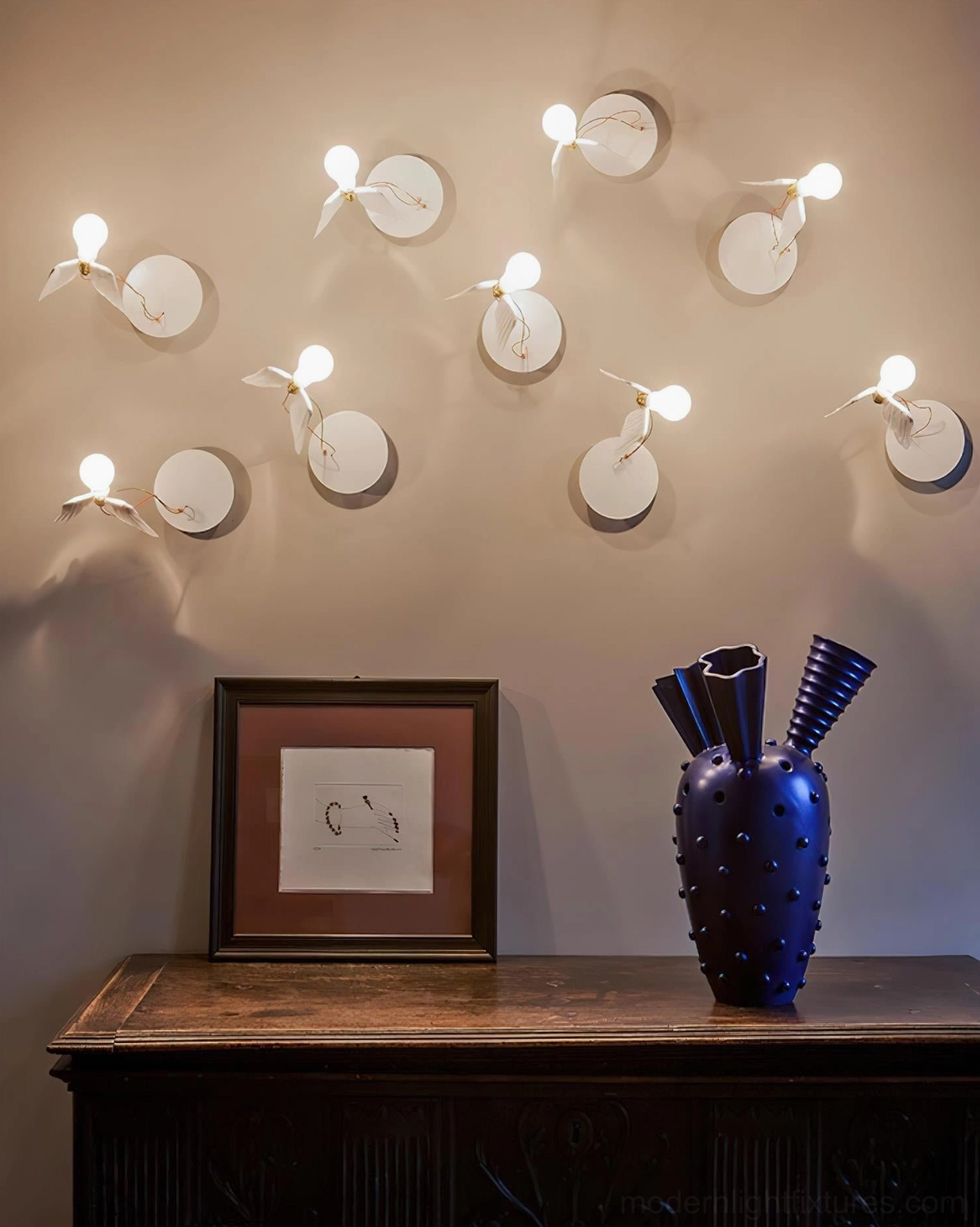 Feathered wall lamp artistic wing design detail showing intricate craftsmanship and sculptural quality