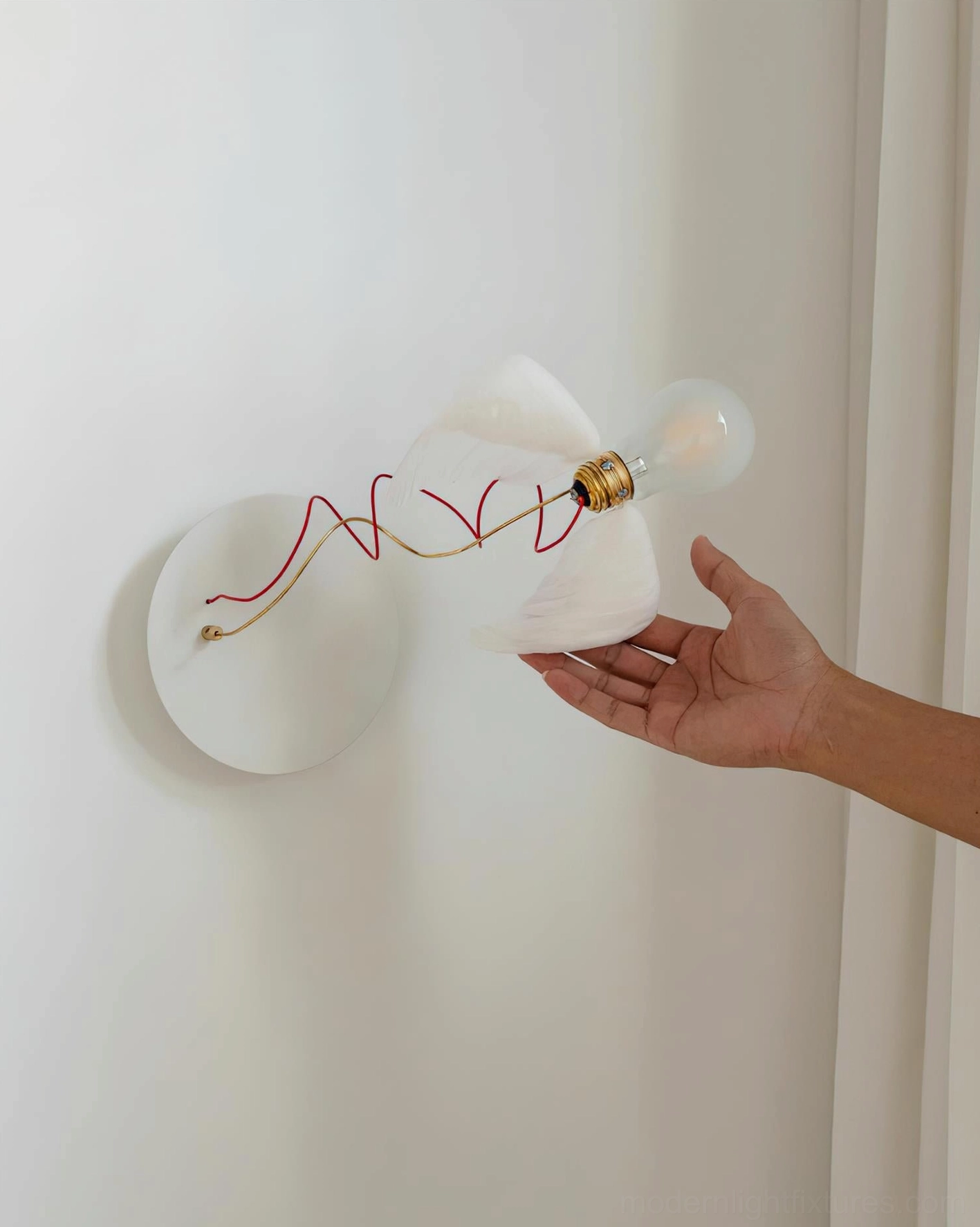 Feathered wall sconce contemporary art lighting fixture with angel wing inspiration and ethereal design