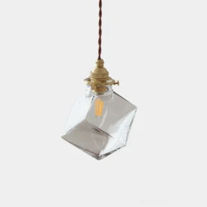 Felix geometric clear glass pendant light with brass fixture and brown twisted cord, front view, minimalist industrial style