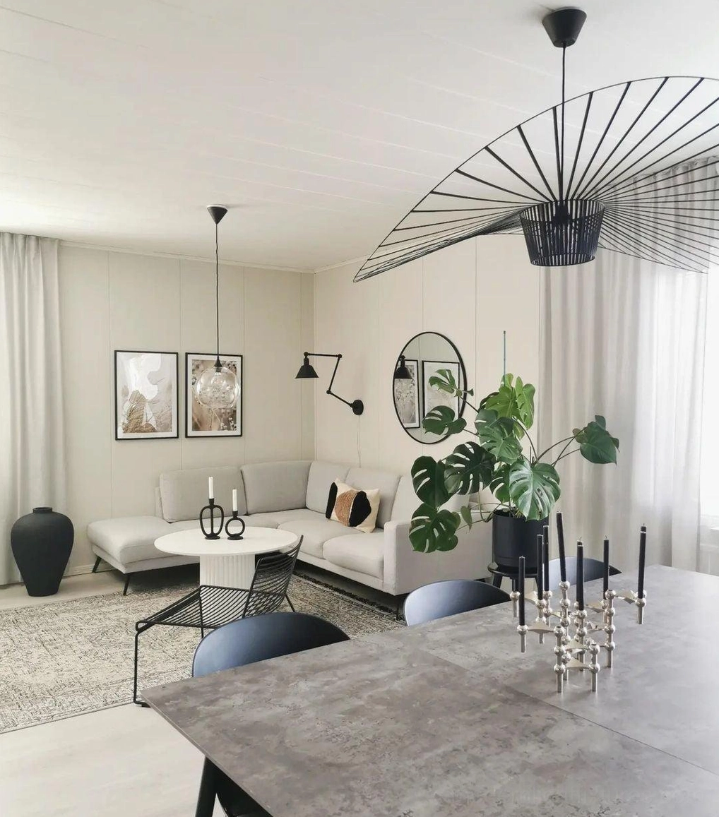 Woven fiber glass pendant lamp paired with floor lamp layered lighting strategy