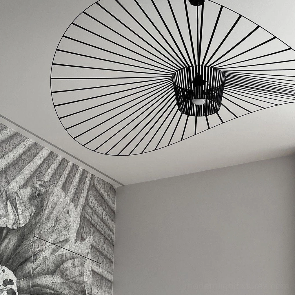 Woven fiber glass pendant lamp in open-plan loft space defining zone boundary