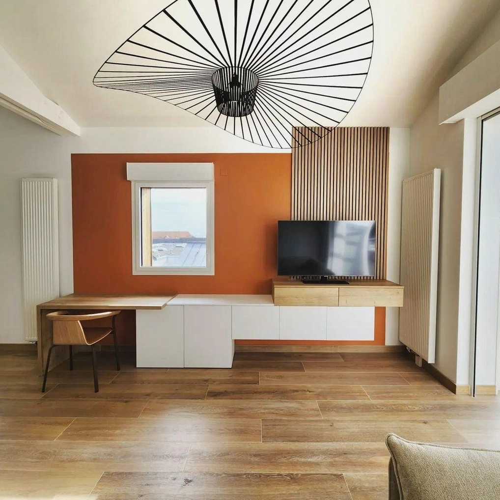 Woven fiber glass pendant creating visual hierarchy in contemporary interior space