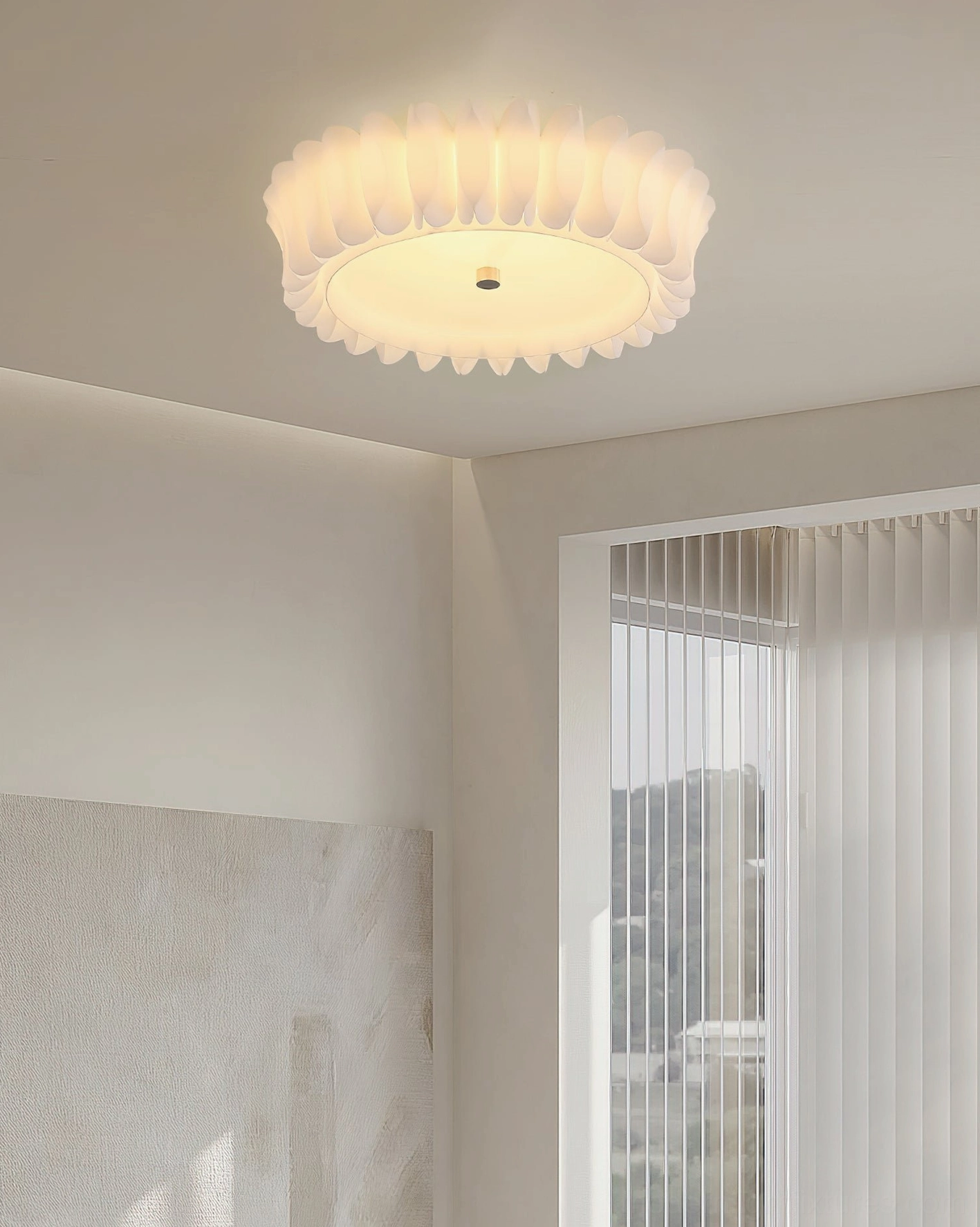Compact flush mount ceiling light in minimalist corner space, neutral warm-tone ruffled petal fixture