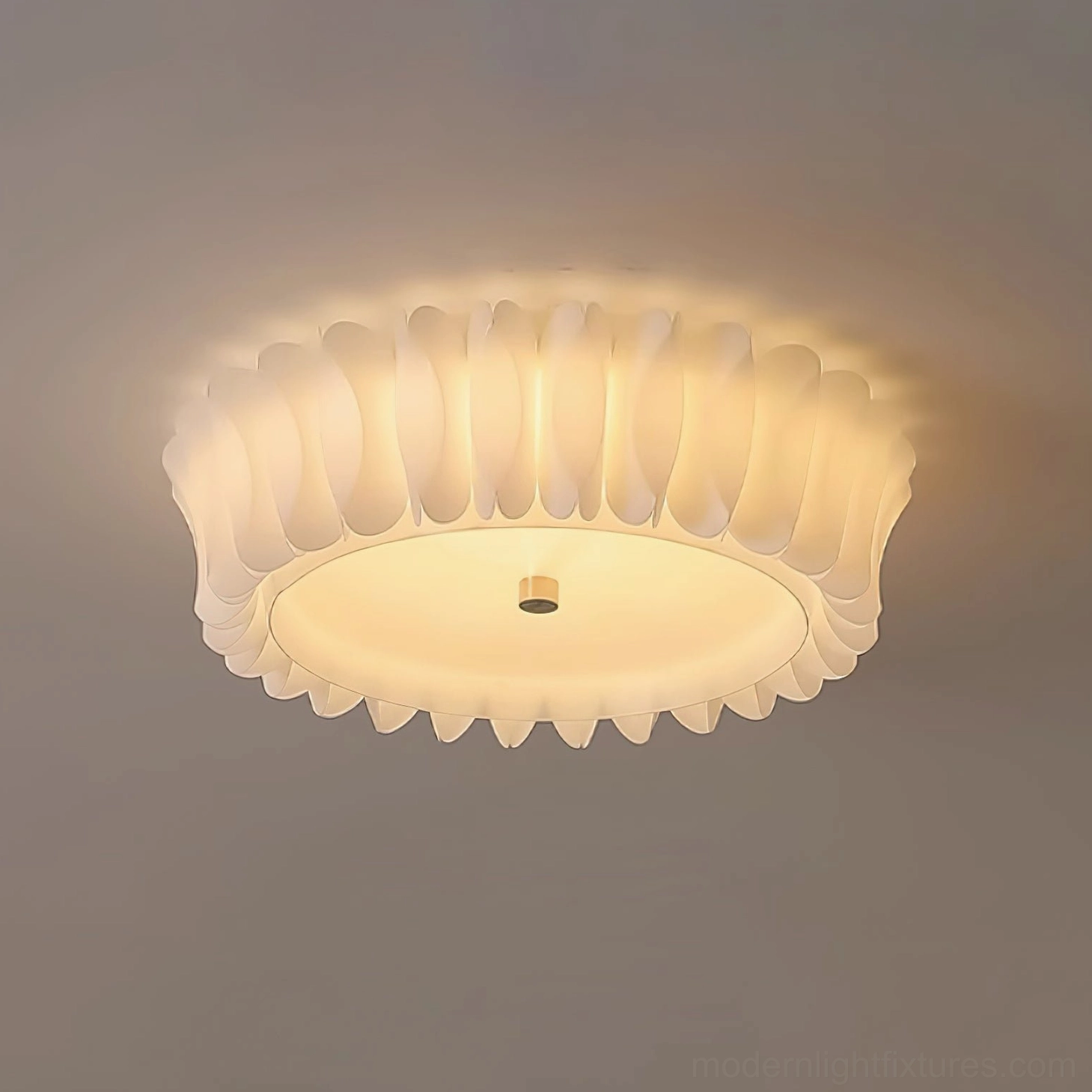 Contemporary ruffled ceiling fixture installed above neutral minimalist interior space