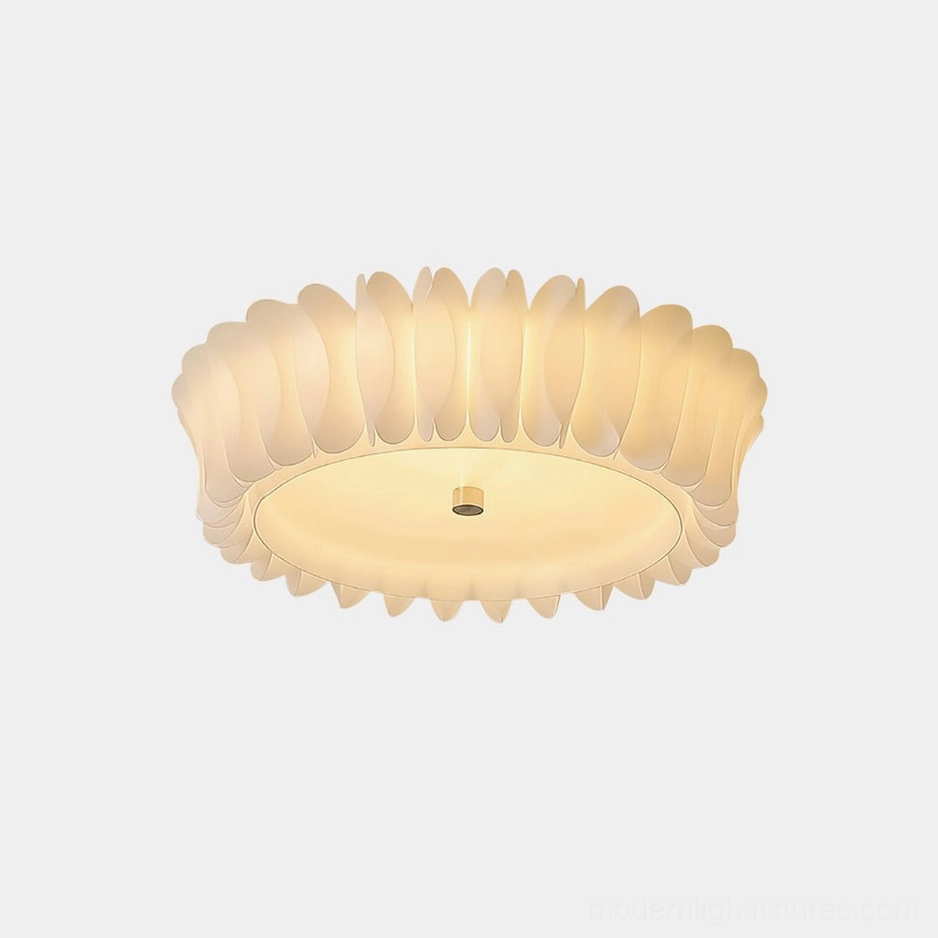 Figura ruffled flush mount ceiling light with cream petal-shaped trim, front close-up studio shot