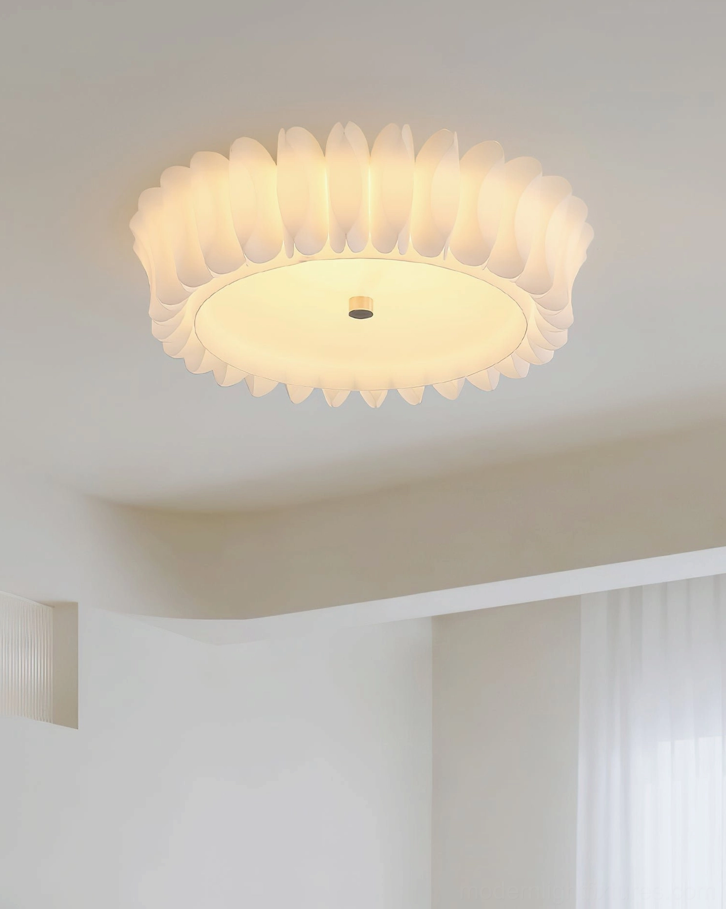 Close-up detail of Figura ruffled ceiling light showing off-white petal edges and glowing LED center