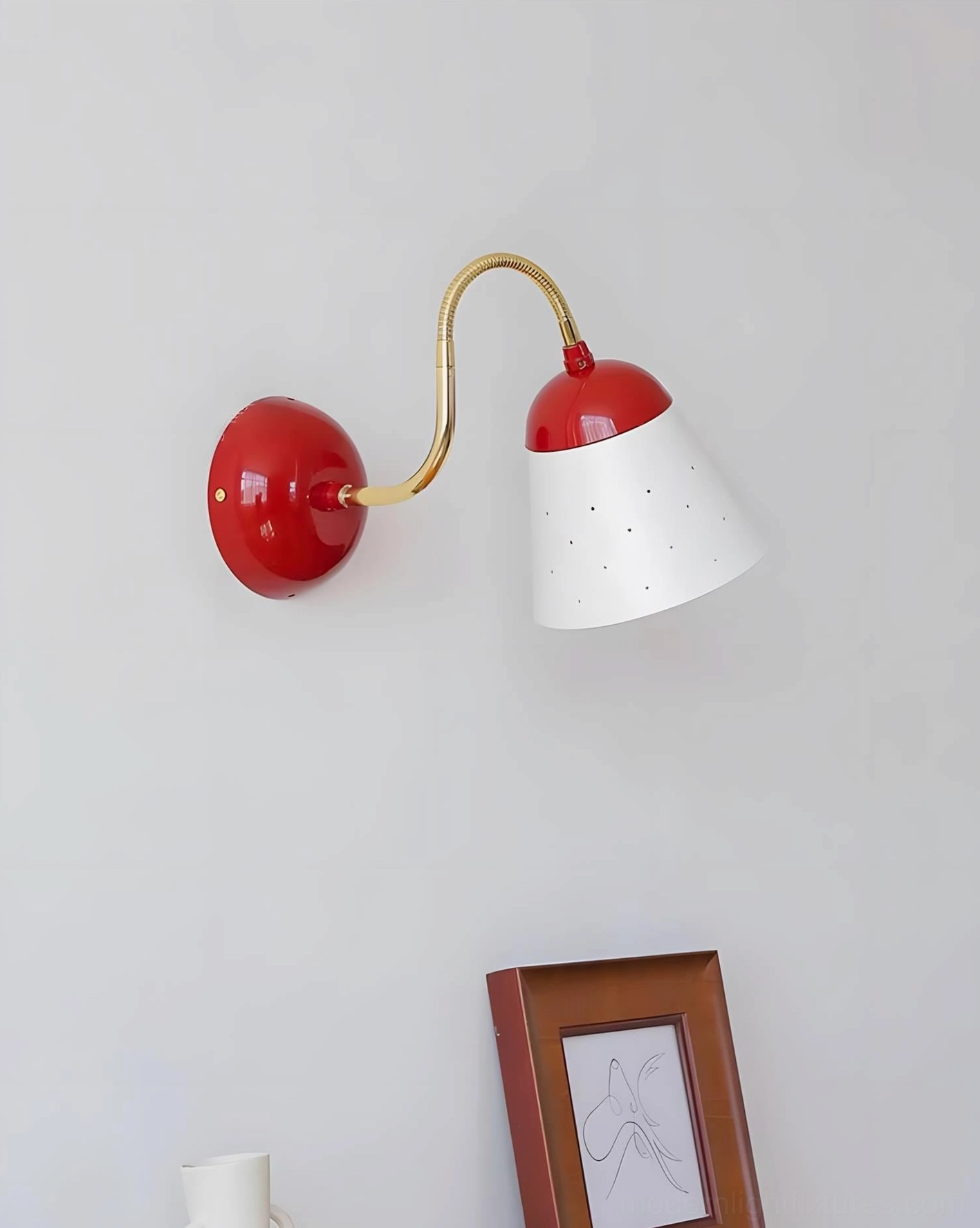 Filo gooseneck wall sconce demonstrating flexible directional positioning and adjustable arm function