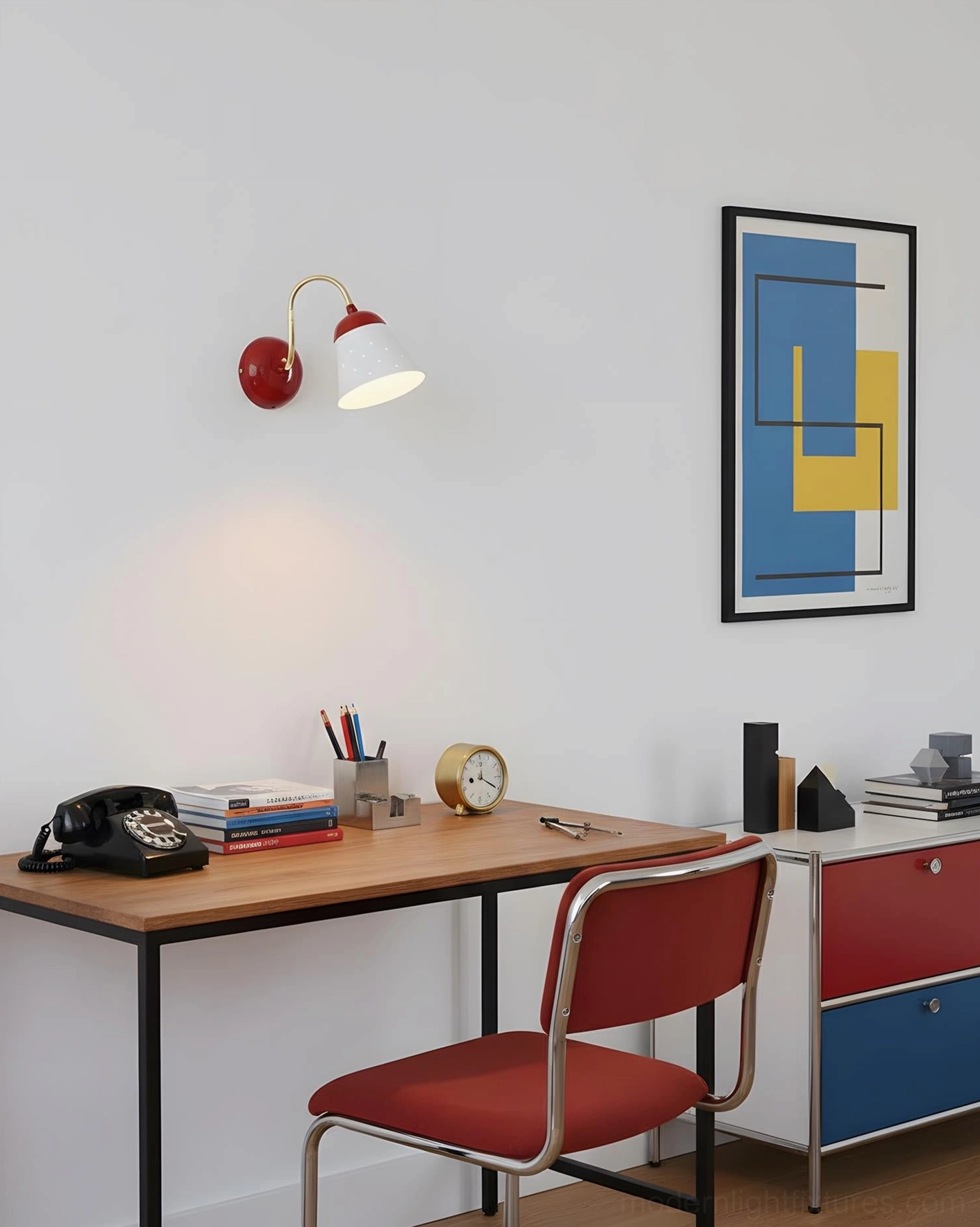Filo modern wall sconce with red accent above wooden study desk in contemporary home office design