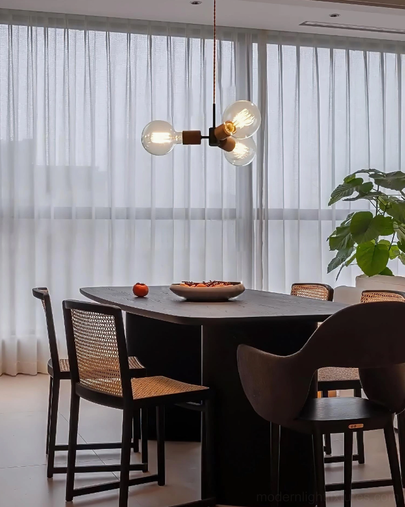 Filotto 3-head glass wood pendant light in minimalist industrial dining room with large windows