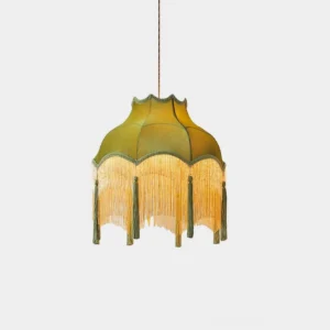 Fina green velvet tassel pendant light with brass accents shown in studio front view