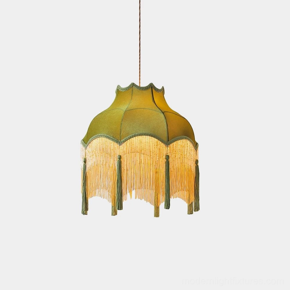 Fina green velvet tassel pendant light with brass accents shown in studio front view