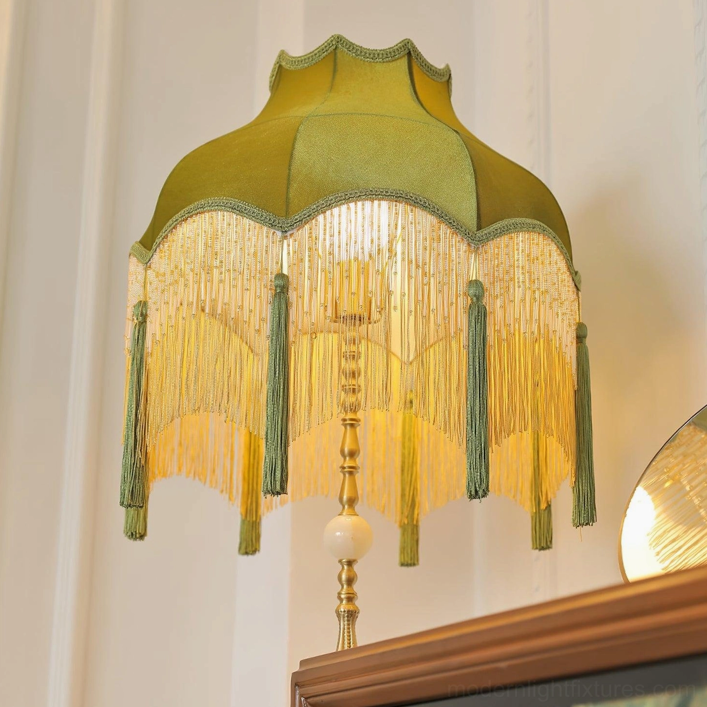 Illuminated Fina Tassel Floor Lamp near vanity mirror with warm ambient lighting effect