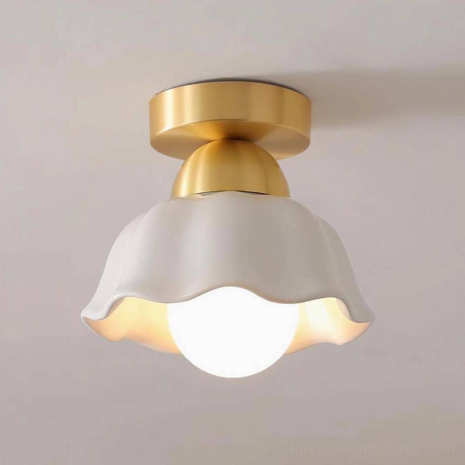 Finley brushed brass ceiling lamp with organic wavy ceramic shade, three-quarter angle showing sculptural petal-inspired design
