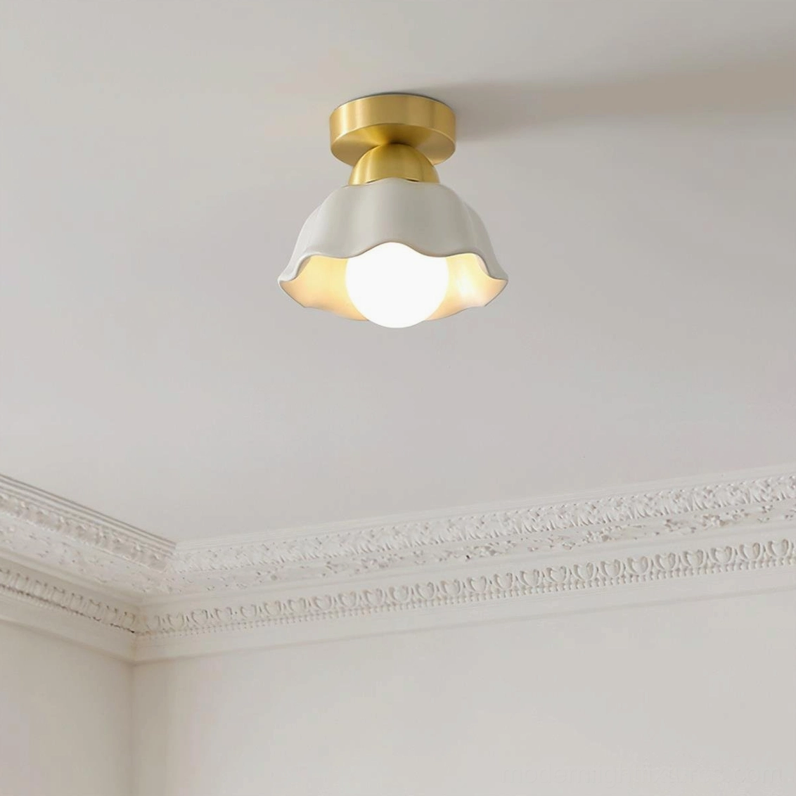 Finley compact semi-flush ceiling light mounted overhead with illuminated bulb, top-down view showing profile and crown molding compatibility