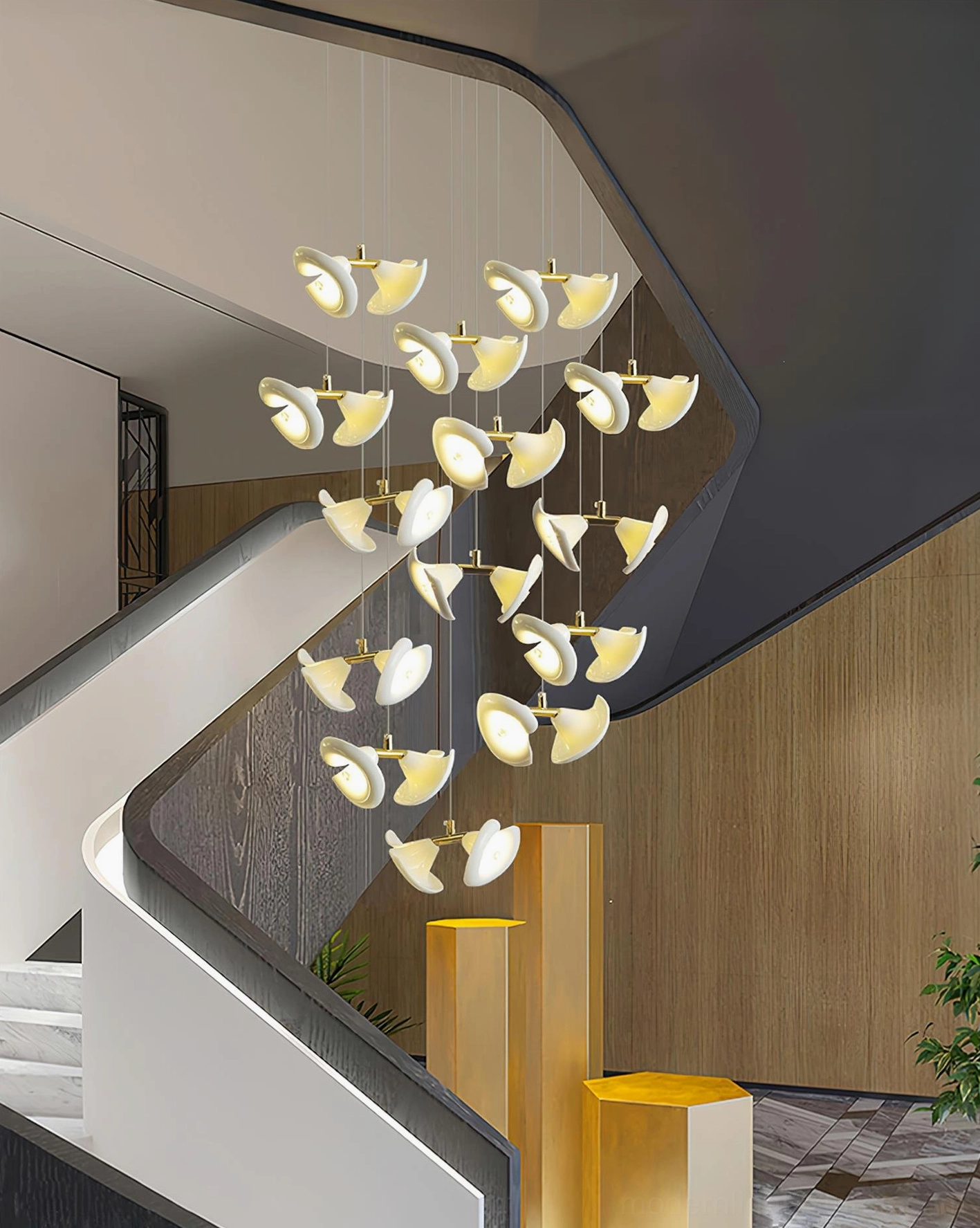 Contemporary cluster chandelier in luxury modern stairwell with illuminated warm light effect