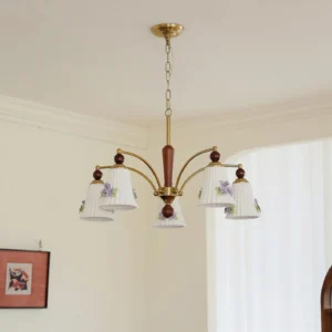 Fiorenta chandelier installed in minimalist cream living room with ceiling mount and elegant wall art backdrop
