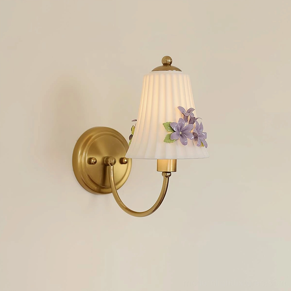 Fiorenta floral wall lamp front flat view with warm brass base and pleated shade with purple flower accent