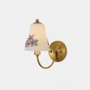 Fiorenta floral wall sconce front view with brass metal arm and pleated white shade featuring hand-painted lavender flower accents