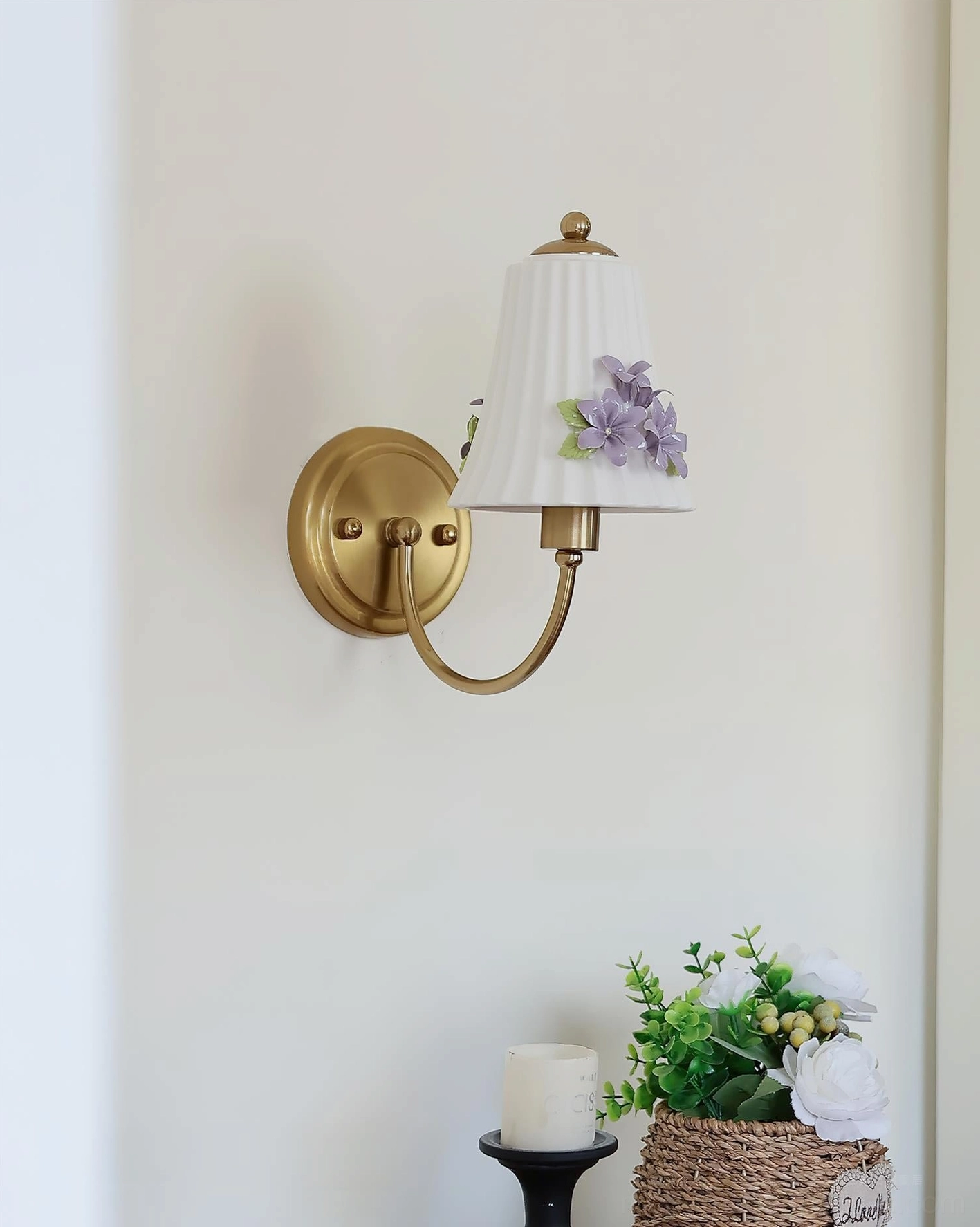 Fiorenta wall sconce side profile showing circular brass wall mount and hand-crafted floral shade details