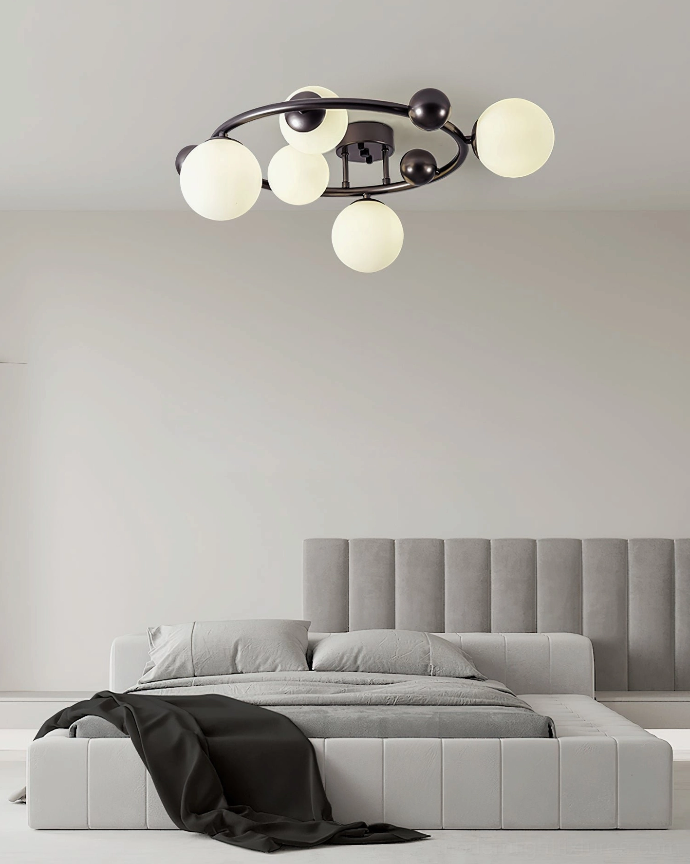 5-globe sputnik ceiling lamp installed in minimalist modern bedroom - warm glowing frosted glass shades