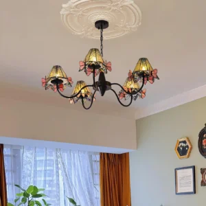 Five-light butterfly Tiffany chandelier installed in living room with ceiling medallion, black metal frame with stained glass shades