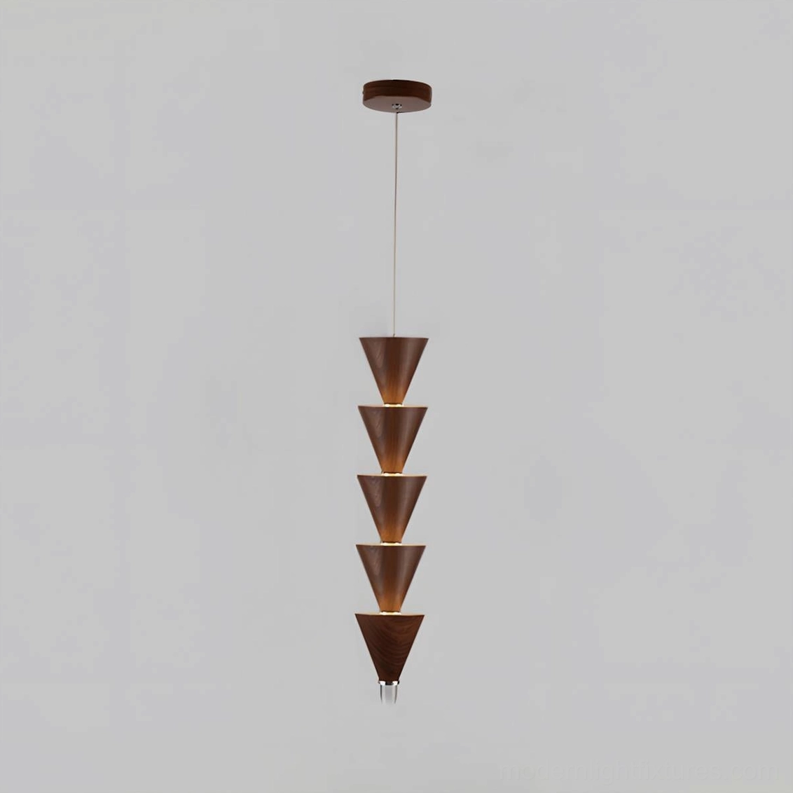 Five-tier stacked cone pendant light in minimalist bedroom with warm illumination