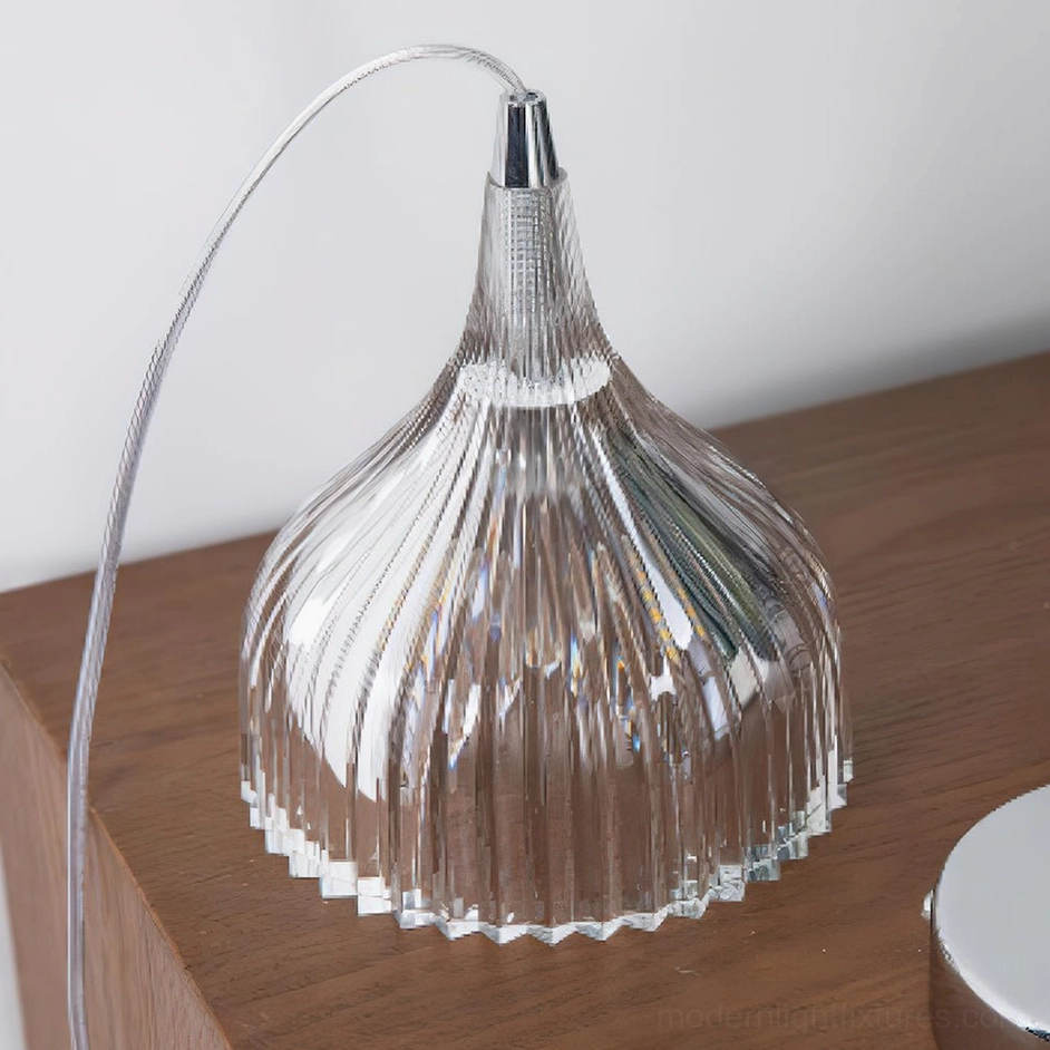 Flare clear ribbed pendant lamp in sleek modern bedroom with chrome fixtures and contemporary furnishings