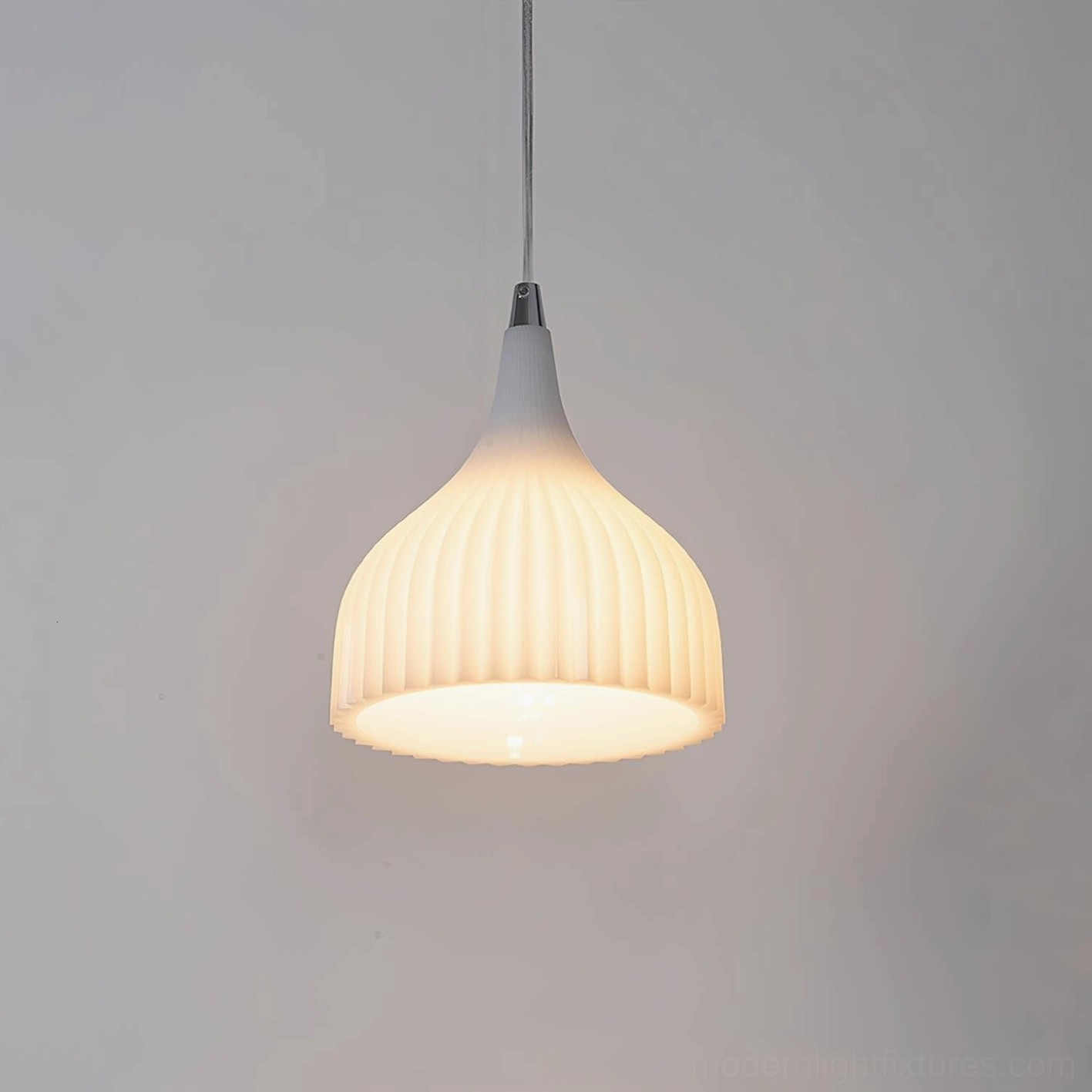 Orange Flare ribbed pendant light in contemporary bohemian interior with bold color accents and eclectic decor