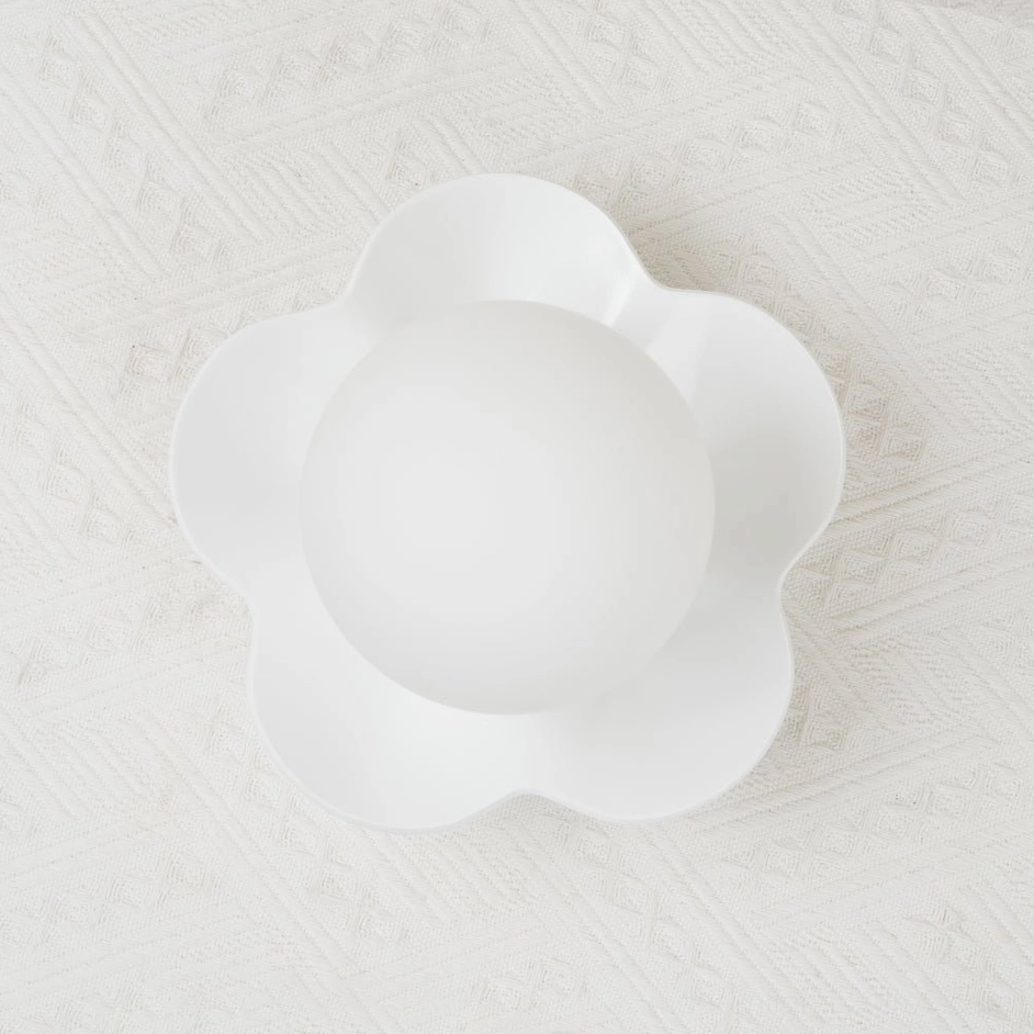 Fleur sculptural wall sconce with shadow detail - petal form casts dimensional shadow from ambient daylight
