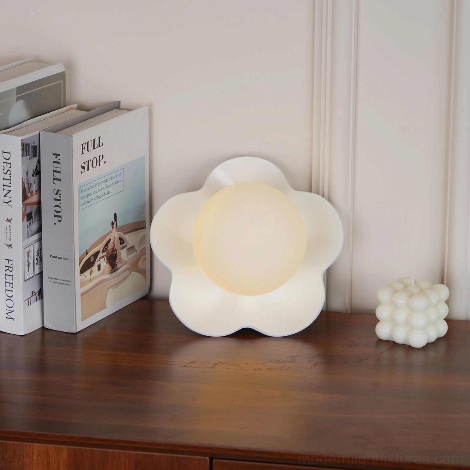 Fleur sculptural wall lamp in bedroom corner - contemporary flower sconce provides intimate layered lighting