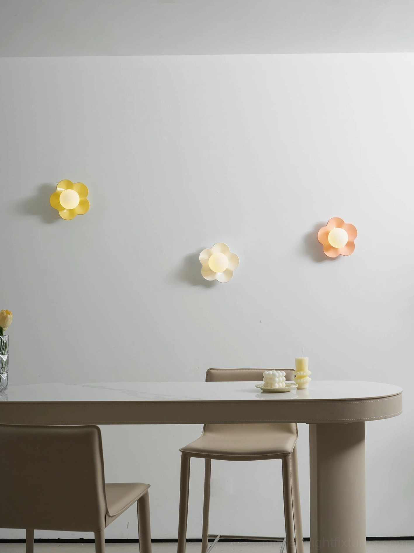 Fleur wall lamp beside bedroom bed frame - intimate modern wall sconce positioned at eye level for reading light