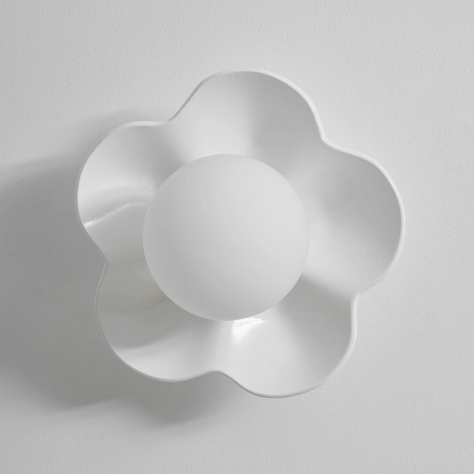 Fleur wall lamp contemporary art installation context - sculptural botanical sconce gallery aesthetic
