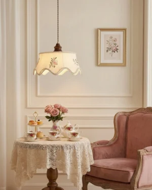 Fleurina embroidered pendant light hanging in vintage French country dining lounge with pink armchair and beige neutral decor