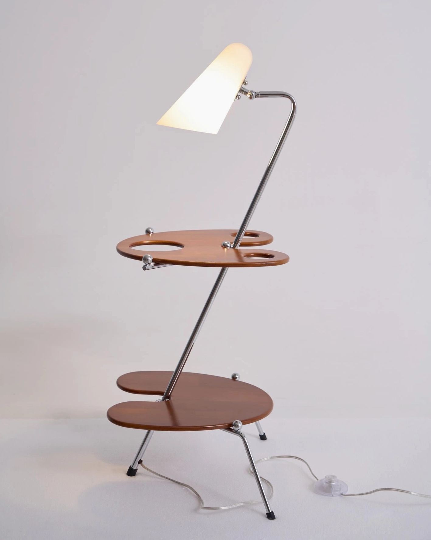 Modern floor lamp with polished chrome hardware and natural wood shelves in Japandi interior style