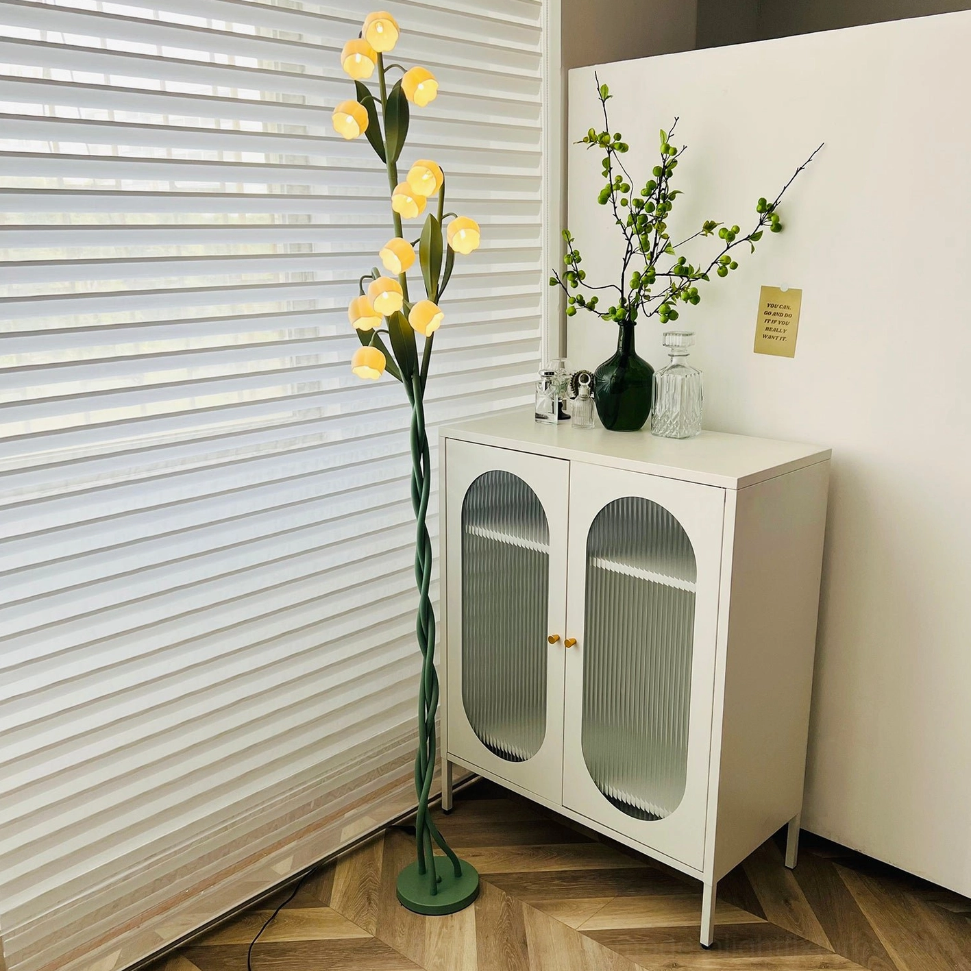 Lily of the valley floor lamp full product view with weighted circular base and green stem construction