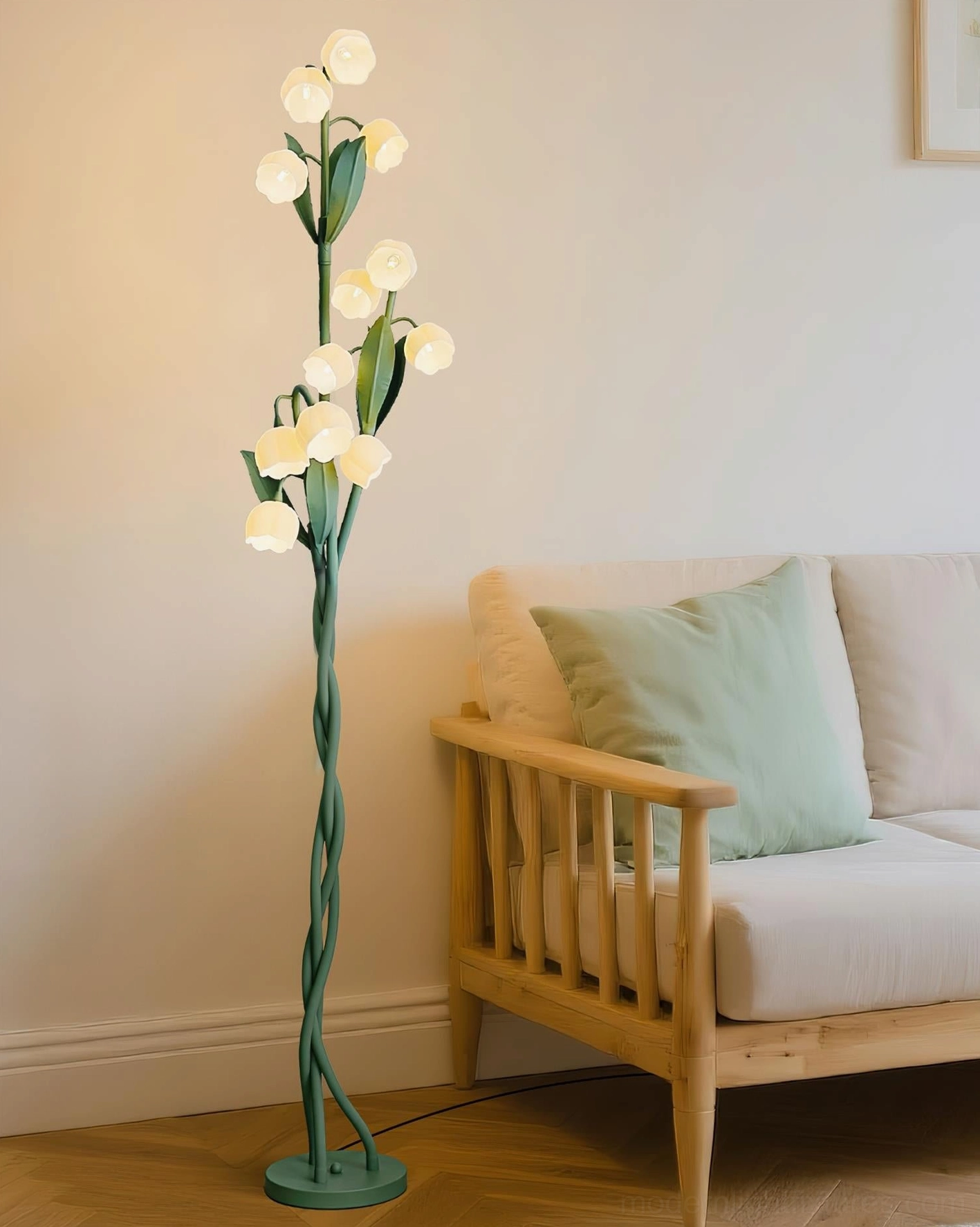 Lily of the valley floor lamp with warm glowing light in Japanese-style living room with wooden sofa and light green cushion