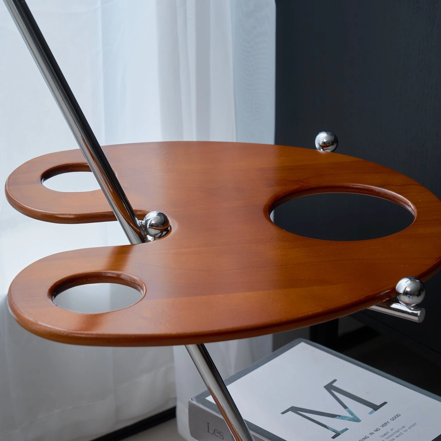 Top view of wooden shelf tray with chrome metal mounting knobs and paint palette design on modern floor lamp