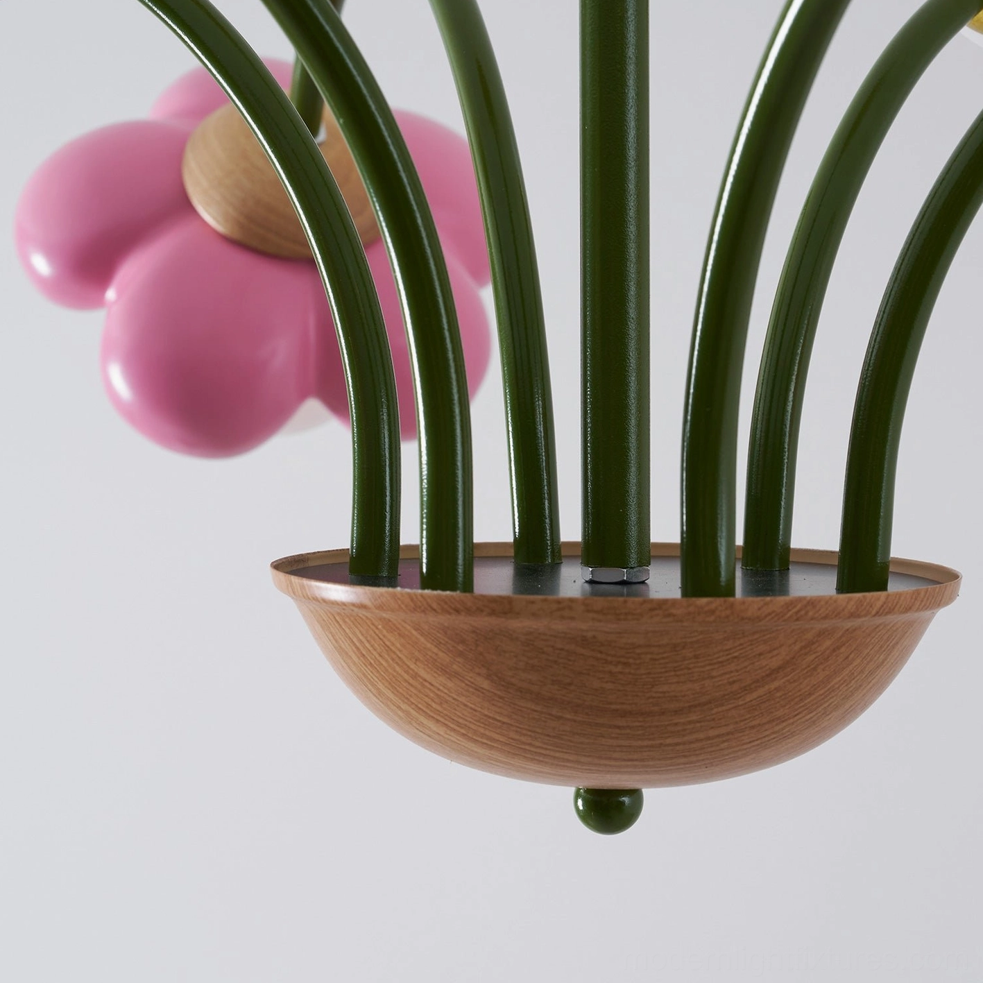 Floral ceiling light fixture close view of petal sculpting and internal bulb illumination mechanism