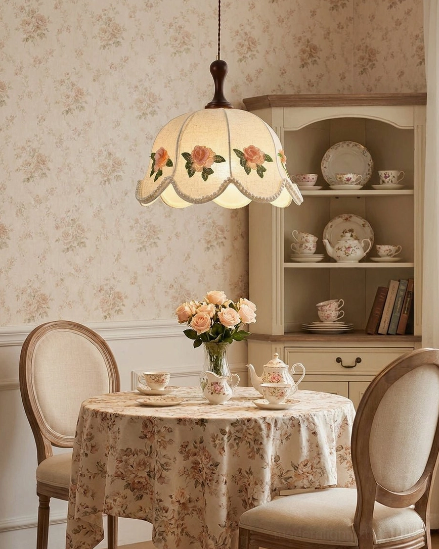 Floral embroidered pendant light hanging in formal vintage dining room, coordinated with floral wallpaper and cabinetry