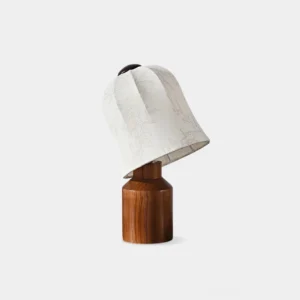Front studio view of floral fabric table lamp with wooden base, featuring delicate botanical print shade and solid wood pedestal