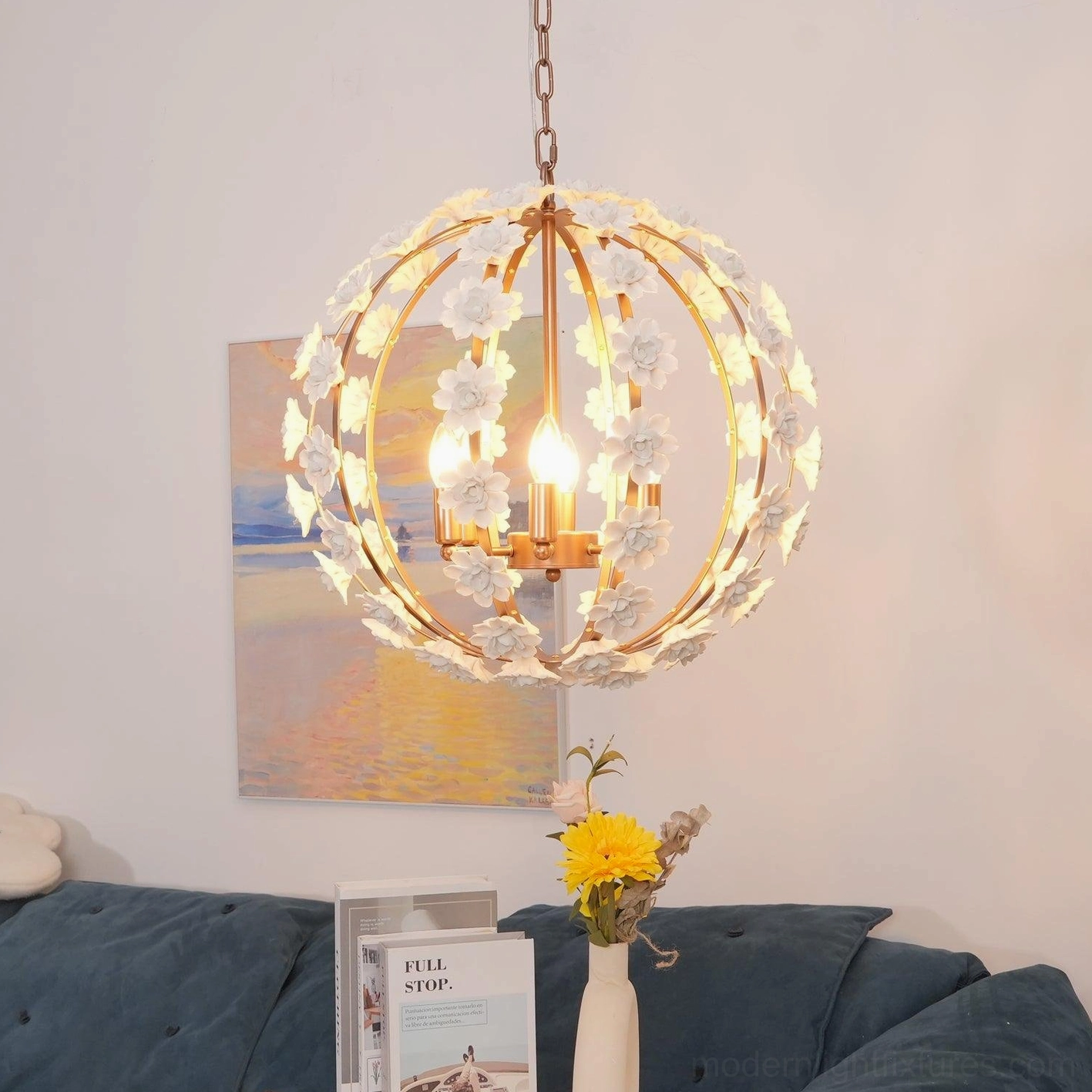 Illuminated ceramic flower pendant light casting warm glow in contemporary living space